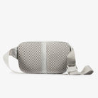 Ash gray sling bag with textured mesh back panel and adjustable strap