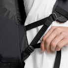 Dark gray backpack shoulder strap with adjustable buckle and secure webbing attachment