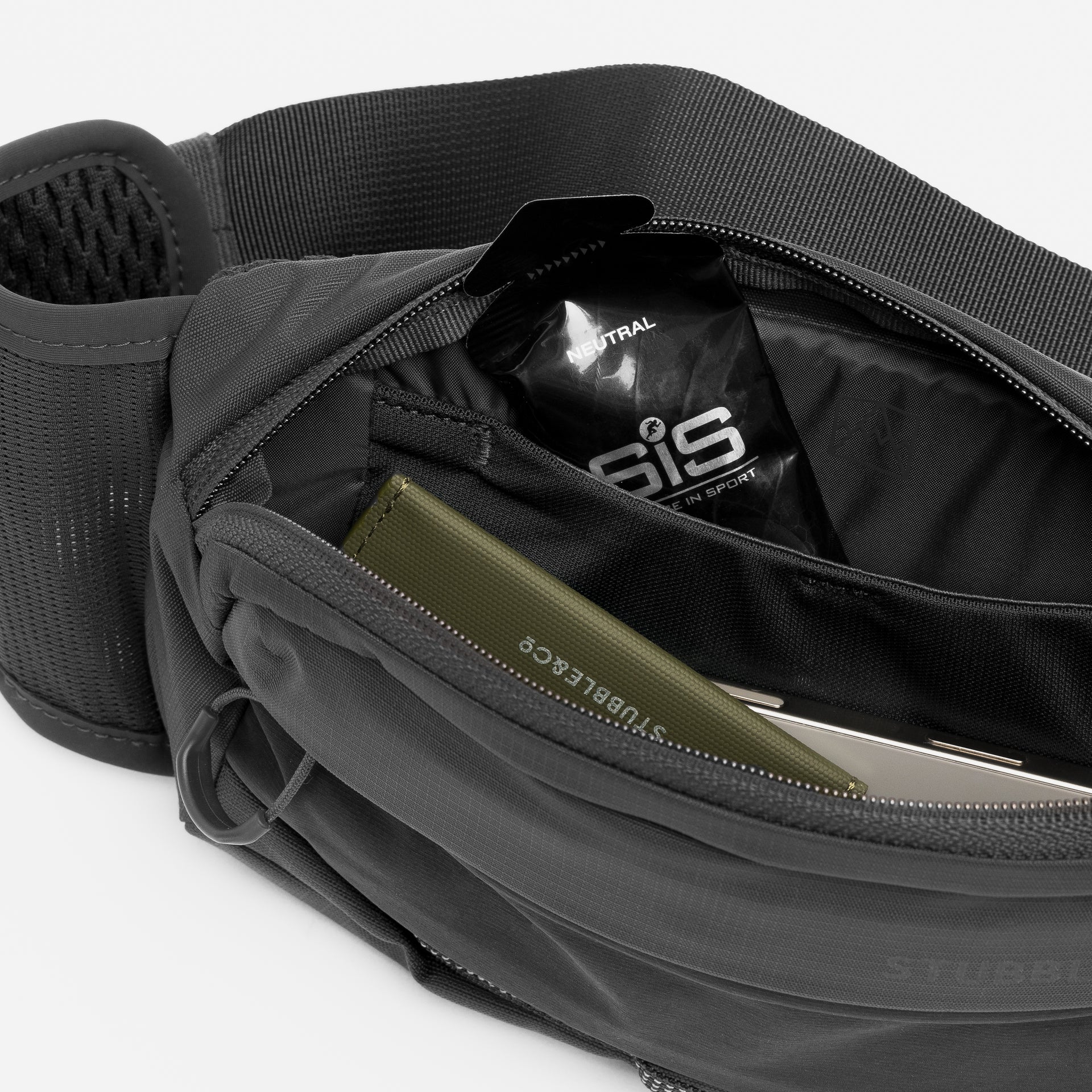 Charcoal waste pack interior with elastic pocket and divider section