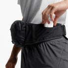 Charcoal waste pack with top zipper opening and front pocket for storage