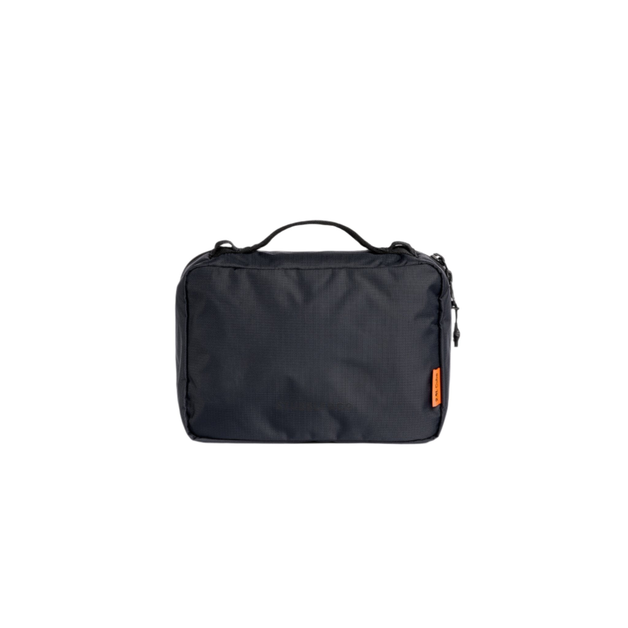 Small black packing cube with front logo patch and orange tag