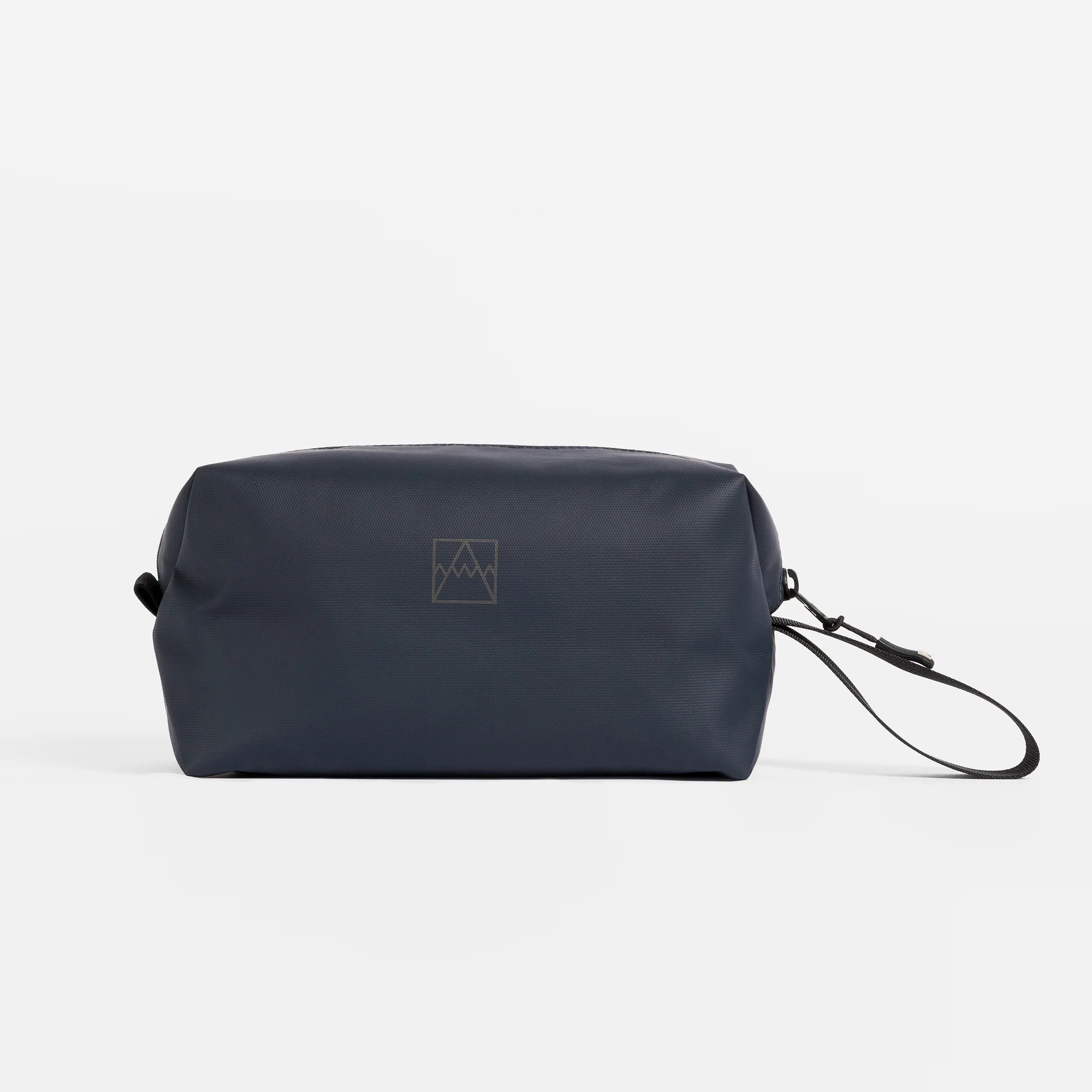 Waterproof wash bag in midnight blue with wrist strap and side carry loop.