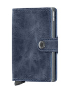 Blue leather miniwallet with button tab and embossed SECRID logo